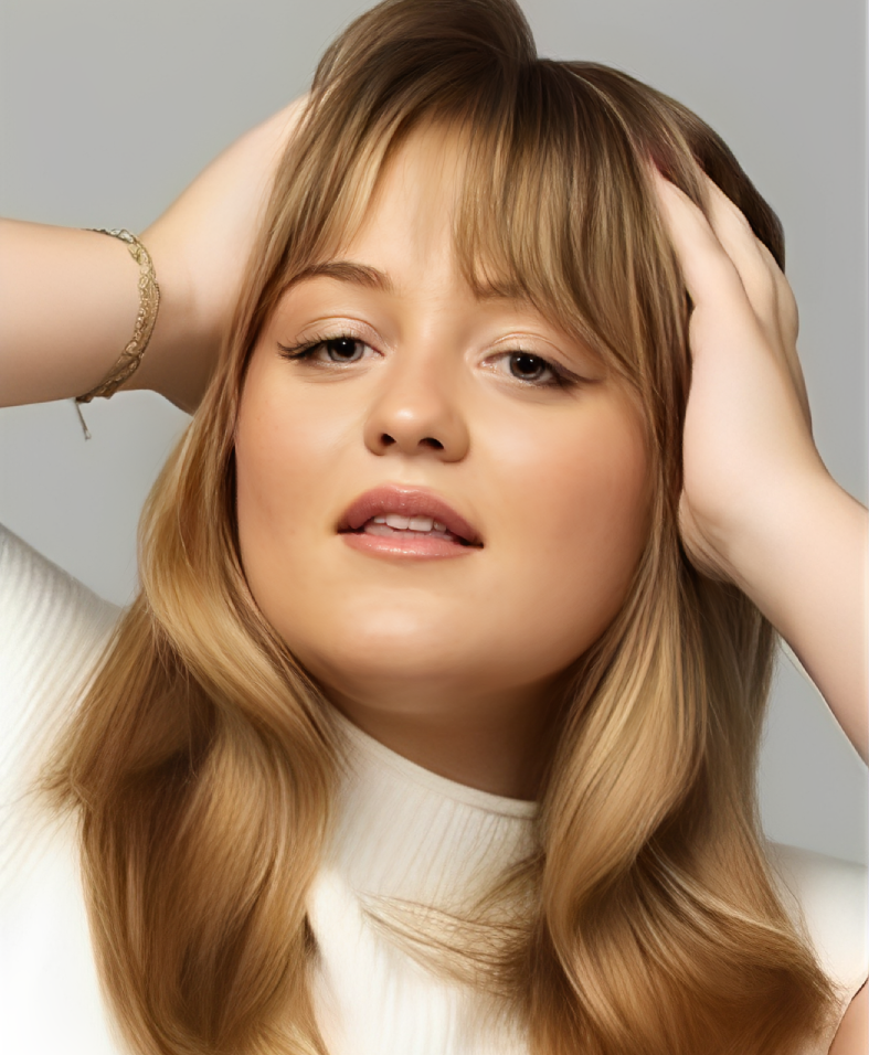 Blonde woman with bangs posing confidently