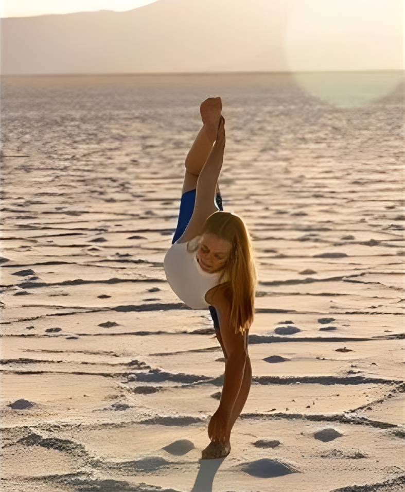 Yoga on desert landscape at sunset