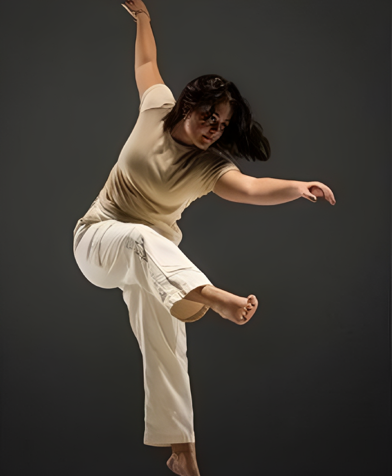 Woman in mid-air dance move