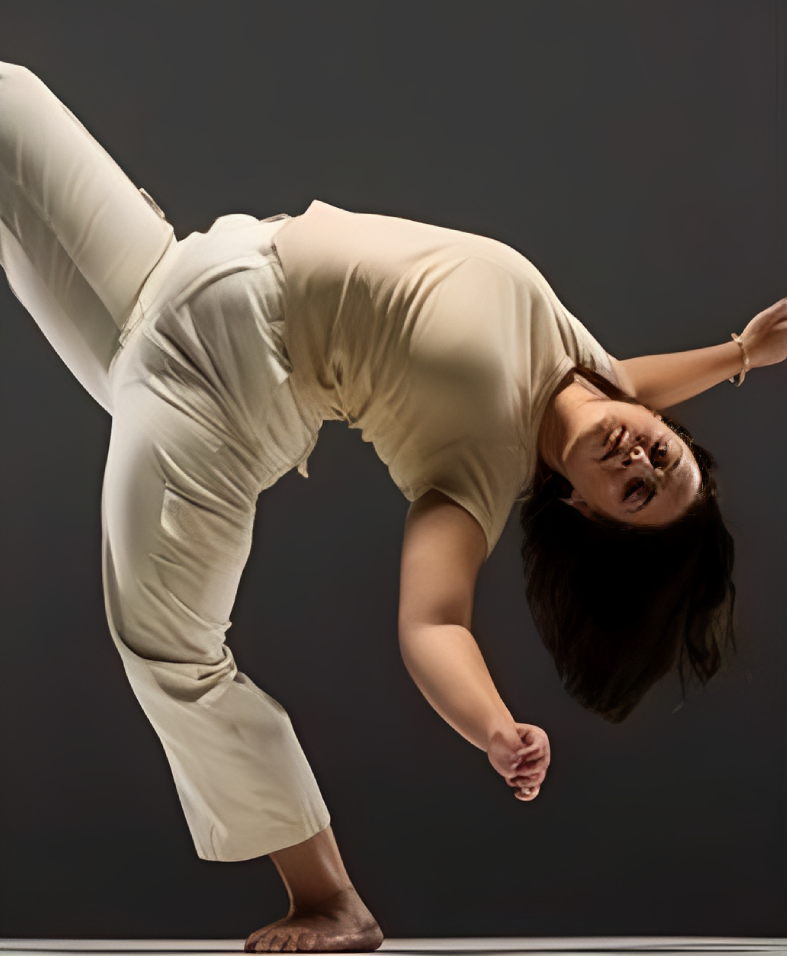 Dancer bending gracefully in studio pose