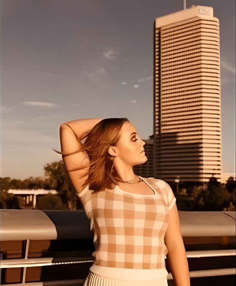 Stylish woman with hand on head